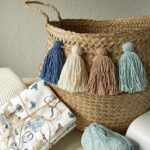 arrullos-bebe-cesto-mimbre-borlas